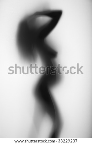 stock photo Naked pregnant woman behind a curtain
