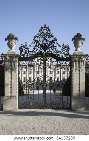 Wrought iron gate of old castle is closed.