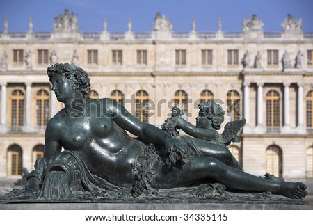 A statue in garden of Versailles, the famous palace of the Sun King: Louis XIV.