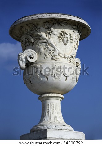Huge fretwork stone vase in the garden of the famous French castle, Versailles