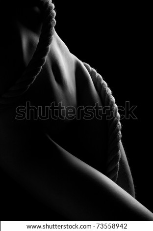 nude, erotic woman body parts and rope