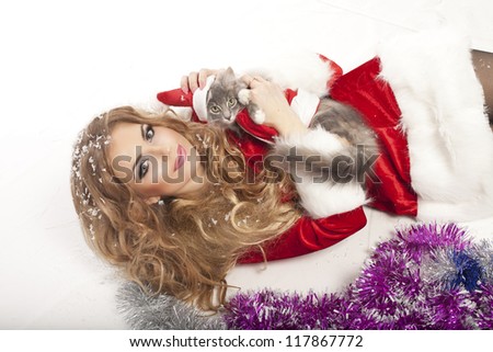 Beautiful christmas woman in Santa Clause costume with extra long curly hair. winter portrait of sexy santa girl with copy space. attractive new year and xmas party lady, isolated on white background