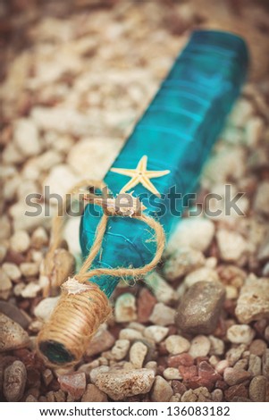 Wedding decoration at sea love letter message in bottle with starfish in water at tropical resort. Romantic and travel concept. Sea beach and ocean. Summer travel. Freedom and dating concept