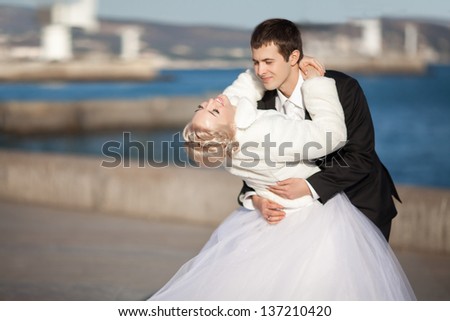 Wedding bride and groom dancing loving couple dance at winter bridal day Enjoy moment of happiness and having fun. playful newlywed family woman and man in love. gorgeous bride and handsome groom.