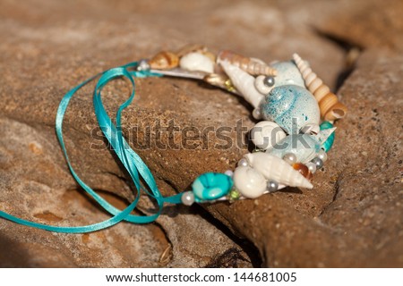 Sea necklace Hand made jewelry shells coral starfish vacation. Jewelry and beauty concept. Travel and vacation at seaside. Mermaid necklace at ocean beach. tropical island Maldives Dominican Thailand