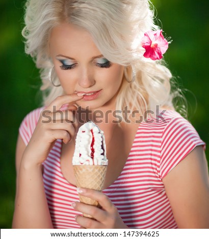 beautiful young woman with cone ice cream in summer garden. happy girl icecream on nature outdoors. Smiling retro woman eating ice-cream in park vacation woman. funny travel concept. Ice cream woman