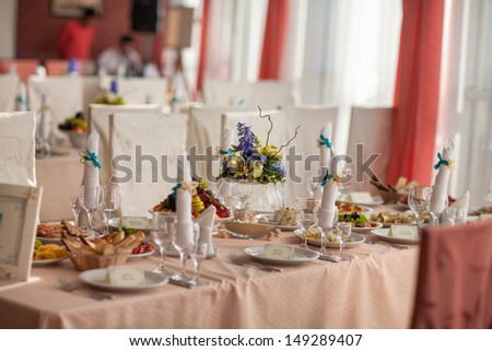Wedding table bridal dinner at royal restaurant cafe at marriage day France. wedding hall. Wedding reception area ready for dinner and party. Table set for an event party or wedding reception. food