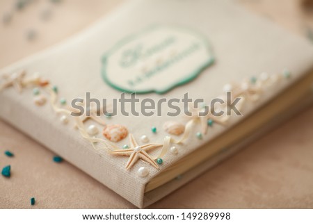 Beautiful wedding decorations. wedding decoration gift book with seashells at tropical royal wedding. wish book at wedding Thailand. wedding decor at sea style.