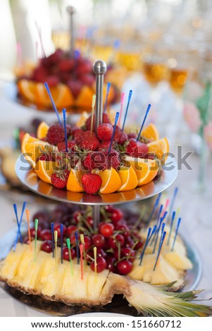 fruits strawberry at party wedding table, wedding party dinner. Fresh summer fruit on table in cafe restaurant. Tasty healthy food for dinner. Thailand. Maldives.