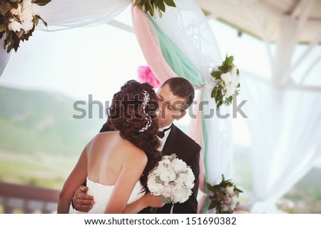 Bride and groom at wedding ceremony. Happy newlywed couple at marriage ceremony. Smiling bride and groom. Beautiful couple in love at honeymoon Thailand. embracing bride and groom. wedding day. series