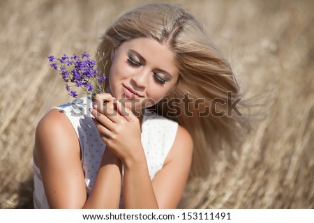 Healthy Young woman outdoors on nature. Happy smiling teenager girl at wheat field. skin and hair care. natural long blonde hair. autumn girl. Attractive pretty girl at wheat field. Sensual blonde.