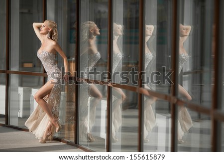 Beautiful young sexy woman in luxurious restaurant interior. Luxury lifestyle. Joy. Elation. Vintage vogue style. pretty young woman in cafe Happy smiling/ luxurious blonde rich lady at retro hotel