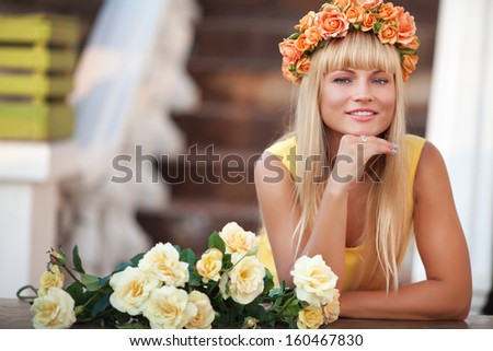 Happy beautiful woman with flowers smiling outdoors. Attractive teenager girl with flower wreath. Natural beauty and cosmetology. Natural blonde woman. carefree friendly approachable girl.
