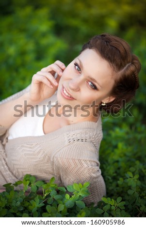Beautiful autumn woman happy smiling outdoors portrait. Excited happy fall woman smiling joyful in autumn park. Autumn girl in woolen accessories outside.
