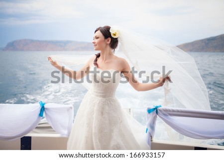 Beautiful Bride on yacht at wedding day. Luxury wedding. Newlywed woman outdoors.