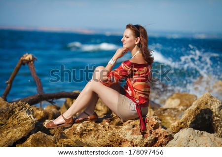 Happy young woman resting at beach at summer lifestyle portrait. Beautiful woman at sea vacation. travel. series