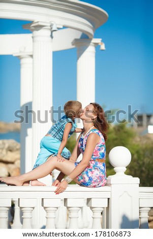 Mother and child playing in park lifestyle, happy family vacation. Young woman and son resting outdoor. series
