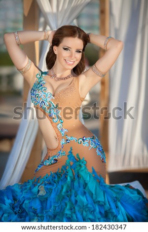 Beautiful belly dancer woman dance in sexy carnival costume, oriental girl bellydance performer. Sexy oriental woman portrait, belly dance movement. series