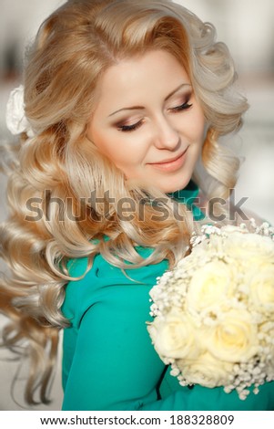 Beautiful young Bride outdoor, woman with wedding makeup and hairstyle retro style. Blonde bride with gorgeous curly hair at sunset - soft focus.