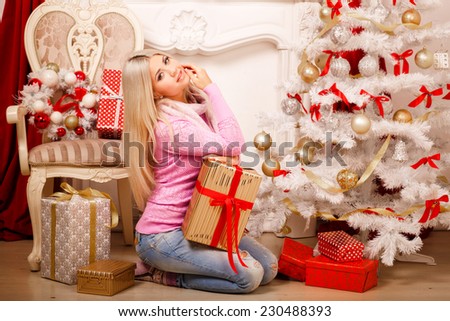 Christmas girl x-mas gift boxes new year 2015, winter december, Smiling happy woman with giftbox at decorated firtree, christmas interior and new year decoration. series