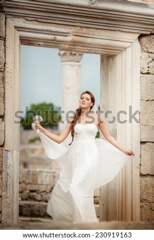 Beautiful young bride outdoors. Happy Bride waiting groom. Marriage Wedding day moment. Bride portrait sunset soft focus, Athens, Greece, series