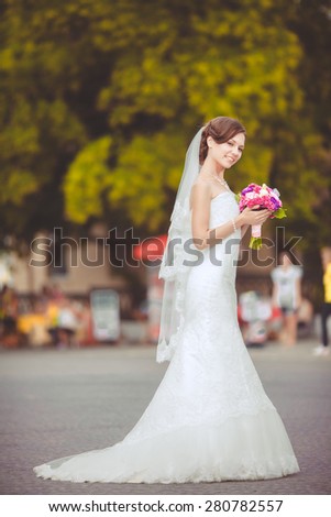 Beautiful young bride wedding makeup hairstyle outdoor marriage day. Happy Bride waiting groom. Marriage Wedding day moment. Bride portrait soft focus, series
