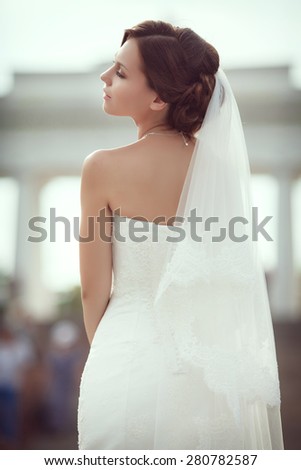 Beautiful young bride wedding makeup hairstyle outdoor marriage day. Happy Bride waiting groom. Marriage Wedding day moment. Bride portrait soft focus, series