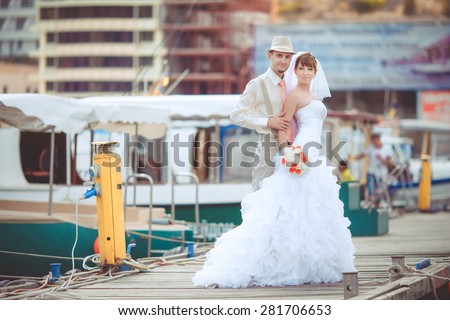 Bride and groom wedding portrait outdoors newlyweds loving couple sea tropical marriage bridal flowers, kissing man and woman at wedding day, selective focus, series