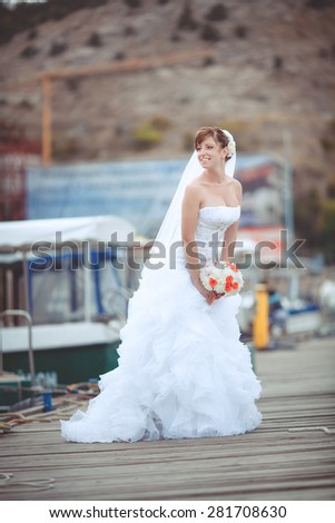 Beautiful young bride outdoors at sea. Happy Bride smiling tropical wedding. Marriage Wedding day moment. Bride portrait