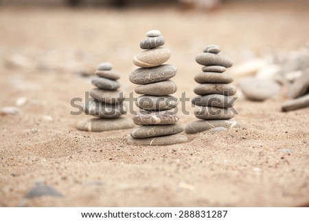 Zen stones garden, Spa stones treatment scene, zen like concepts, Stones pyramid on sand symbolizing zen, harmony, balance, series