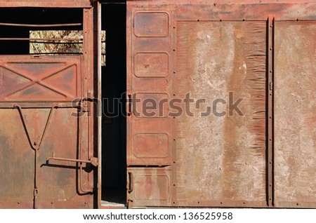 Covered goods railway wagon, sliding door as background
