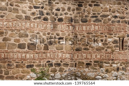 Stone and ceramic ancient church wall as background