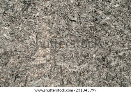 Weathered oriented strand board surface closeup as background