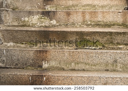 Old weathered vintage grunge stone house staircase closeup as background