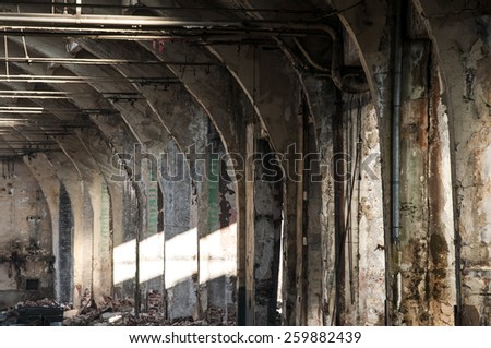 Old abandoned decayed grunge hall of vintage railway plant inside