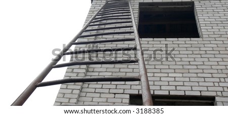 The photo with the image of a long iron ladder which standing near not completed brick house and gets up to its window