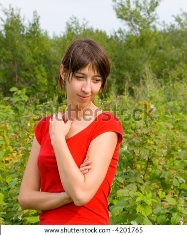 The attractive Russian girl on rest in country garden. A sight not in the chamber. A bright photo about rest in hot months of summer.