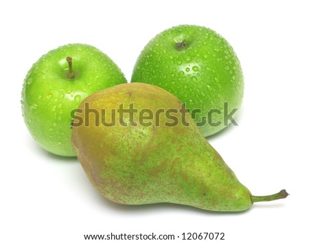 The ripe juicy pear and green apples covered by drops of water. Isolation on white, shallow DOF.