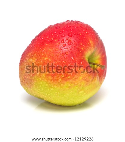 Ripe apple of red color covered by water drops. Isolation. Shallow DOF.