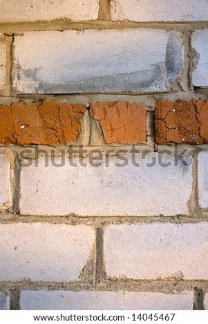 Structure on the basis of the white bricks laid in a wall