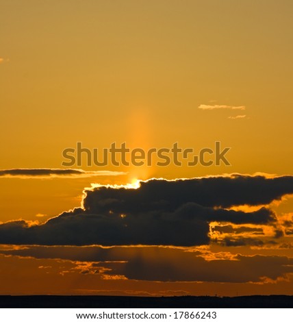 sunset with the cloudy sky. Russia, Ural.