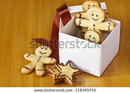 ginger biscuits in a box with a red ribbon