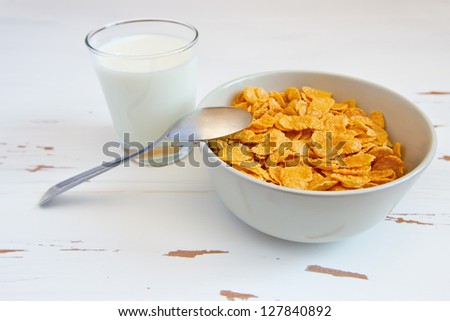 Sweet corn flakes and milk on the table