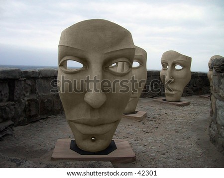 huge sculptured stone masks with body Piercing