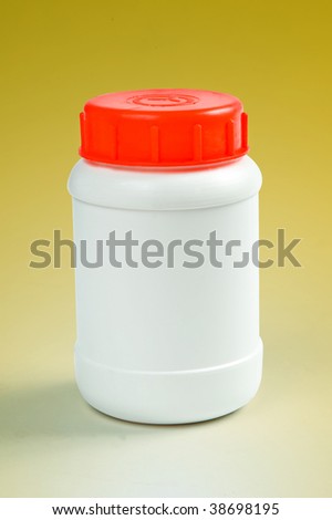 white plastic bottle on yellow background