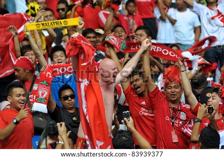 KUALA LUMPUR - JULY 16: Liverpool football club fans during a friendly match against Malaysia XI on July 16, 2011 in Kuala Lumpur, Malaysia. Liverpool won 6-3.