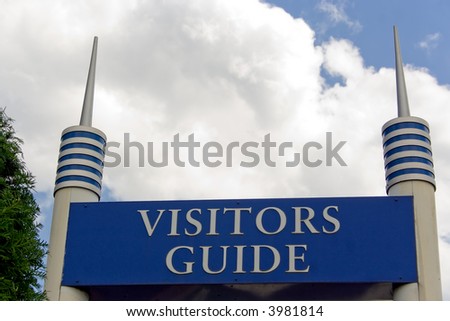 visitors guide sign in shopping mall with blue sky and clouds background
