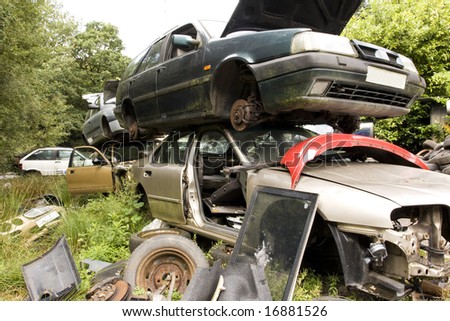 old damaged cars in a breakers yard