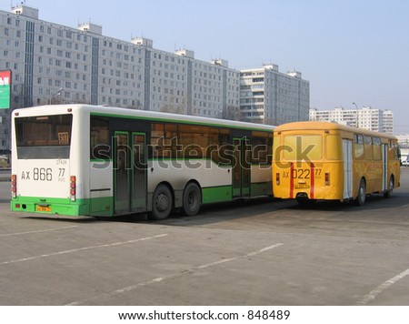 The new bus and old bus from rear side