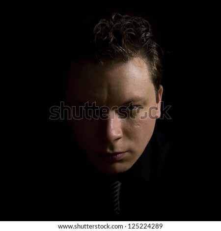 dark portrait of a man.